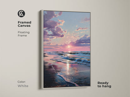 White framed canvas sunset beach art. Floating frame offers a clean look. The sun reflects on the wet sand. Ocean waves crash on the beach. This framed art is ready to hang. Create a peaceful atmosphere.