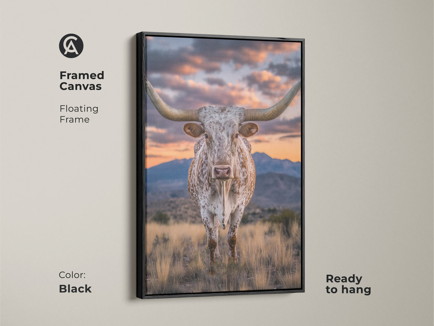 Framed canvas of a longhorn steer with a black floating frame. This rustic western artwork showcases a mountain sunset. This farmhouse landscape art is ready to hang. It's a perfect cowboy gift.