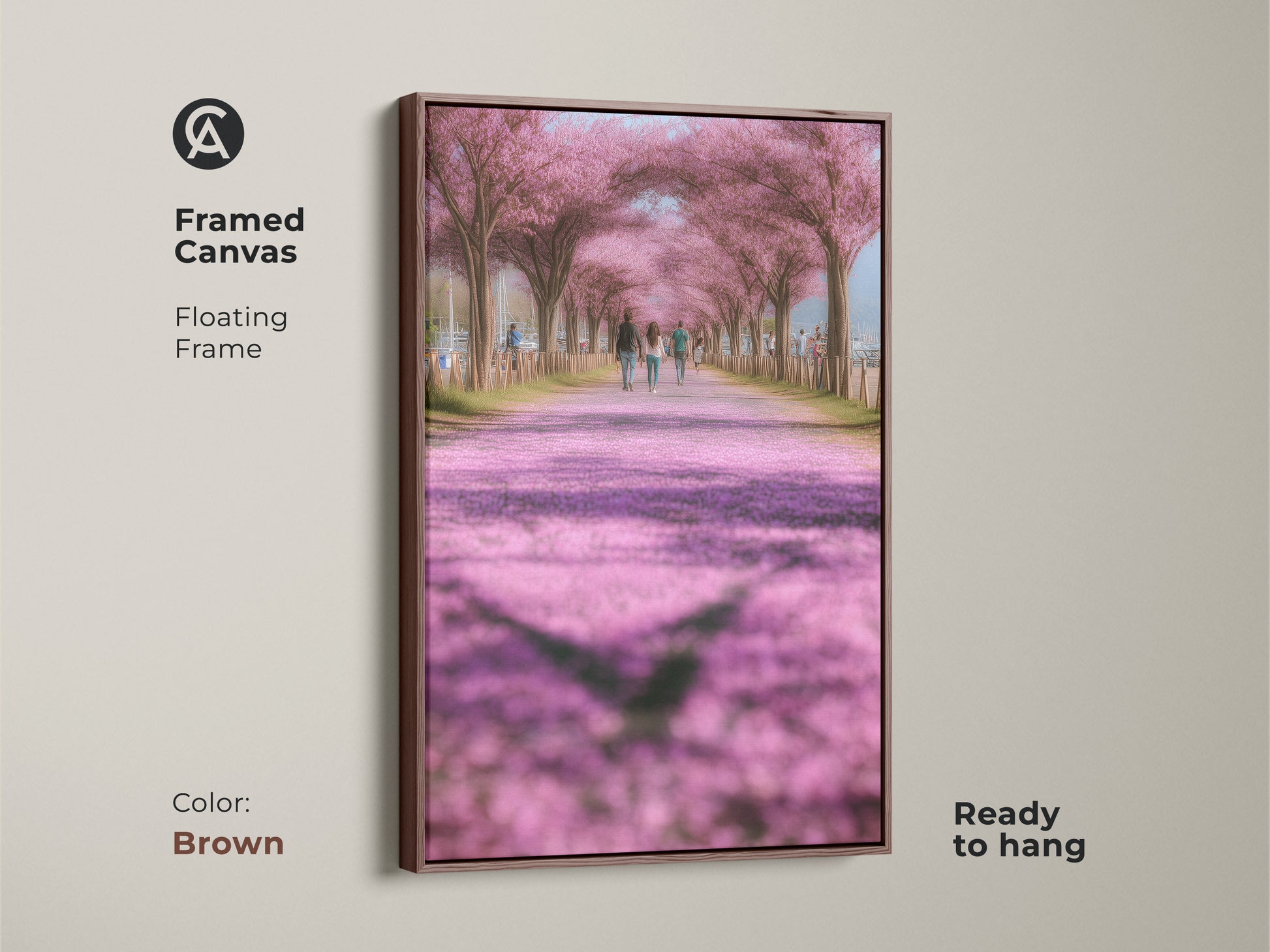 Framed canvas art print with a brown floating frame showcasing a cherry blossom path. This romantic spring nature artwork is ready to hang. The soft pink and green tones create a peaceful ambiance. Ideal for modern farmhouse decor. A perfect gift for someone who loves nature.
