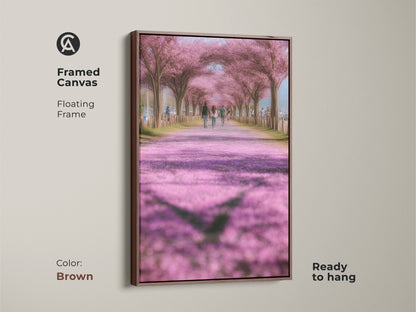 Framed canvas art print with a brown floating frame showcasing a cherry blossom path. This romantic spring nature artwork is ready to hang. The soft pink and green tones create a peaceful ambiance. Ideal for modern farmhouse decor. A perfect gift for someone who loves nature.