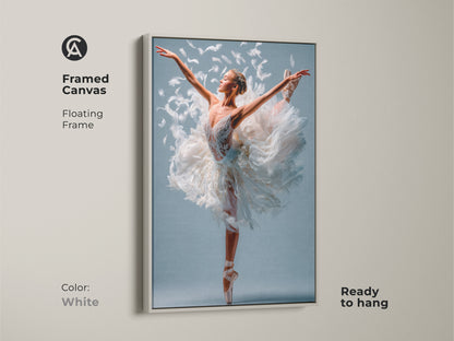 Framed canvas art in white featuring a ballerina in a feathered tutu. The floating frame offers a clean look. This artwork is ready to hang. Add a touch of elegance to your decor with this framed ballet art.