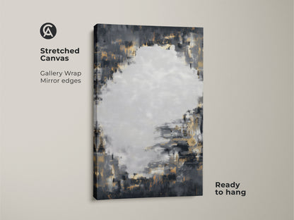 Stretched canvas print featuring charcoal grey and gold abstract art. This textured brushstroke artwork has gallery wrapped edges. The modern abstract painting is ready to hang. It brings a contemporary feel to any space with its neutral palette and metallic accents.