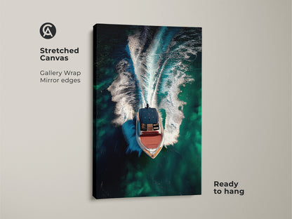 Stretched canvas gallery wrap of an aerial speedboat. The emerald green ocean wall art captures turquoise waters. Ready to hang this contemporary boat artwork adds a nautical theme to any space. Ideal luxury yacht canvas art.