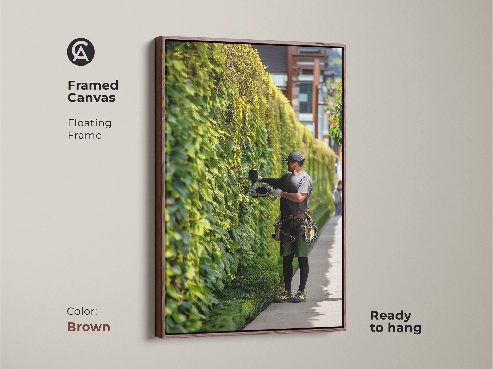 Framed canvas featuring a gardener tending to a vibrant ivy wall. The floating brown frame complements this nature inspired artwork. Ideal wall art for adding a touch of outdoor beauty.