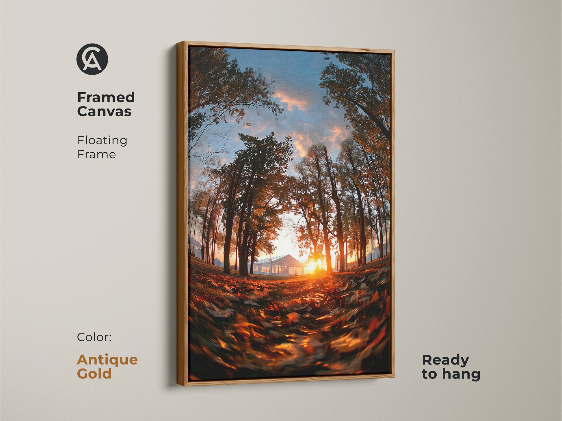 Framed canvas of a sunset through trees with an antique gold floating frame. The sun shines behind a distant house. Fallen leaves cover the ground. This nature art is ready to hang. The antique gold adds a touch of elegance.
