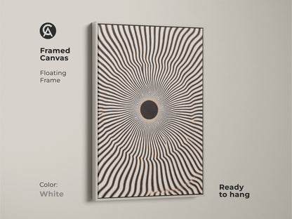 Framed canvas featuring an eye-catching geometric artwork. The floating frame enhances the black and white radial burst. It is ready to hang. The white frame complements minimalist home decor. It adds a modern touch to any room.