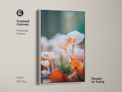 White framed canvas art. This artwork showcases a detailed image of white mushrooms. The white floating frame creates a clean and contemporary look. It's ready to hang and will complement any room.