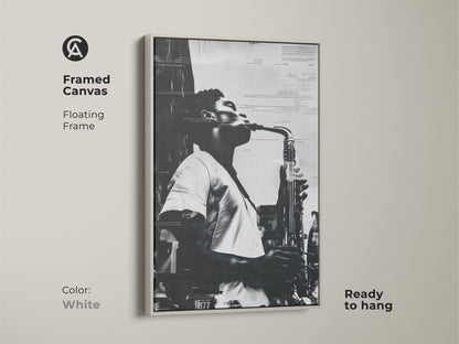 Framed canvas artwork featuring a musician playing saxophone. The white floating frame offers a clean modern look. This black and white musical art is ready to hang. Ideal for jazz enthusiasts and art collectors.