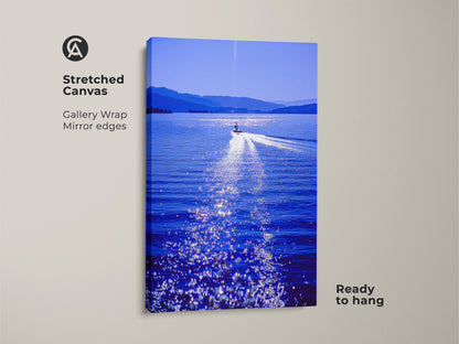 A stretched canvas gallery wrap print of a speedboat on a lake. The deep blue water sparkles in the sun. It's a ready to hang modern art piece perfect for travel lovers and housewarming gifts.