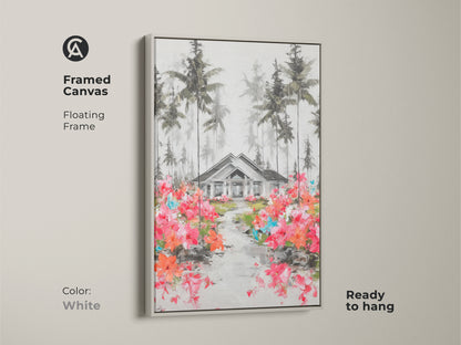 This canvas artwork features a white framed quaint house surrounded by pine trees. This floating frame art print is ready to hang. The blooming path of pink and orange flowers gives it a vintage style. Ideal wall decor for a family home or modern farmhouse entry hall.