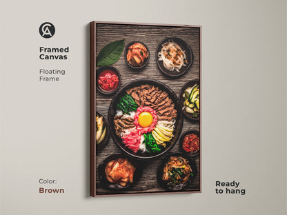 Framed Canvas showcasing realistic Bibimbap artwork Korean gourmet food photography. The canvas features a brown floating frame and comes ready to hang. A perfect contemporary gift for food lovers.