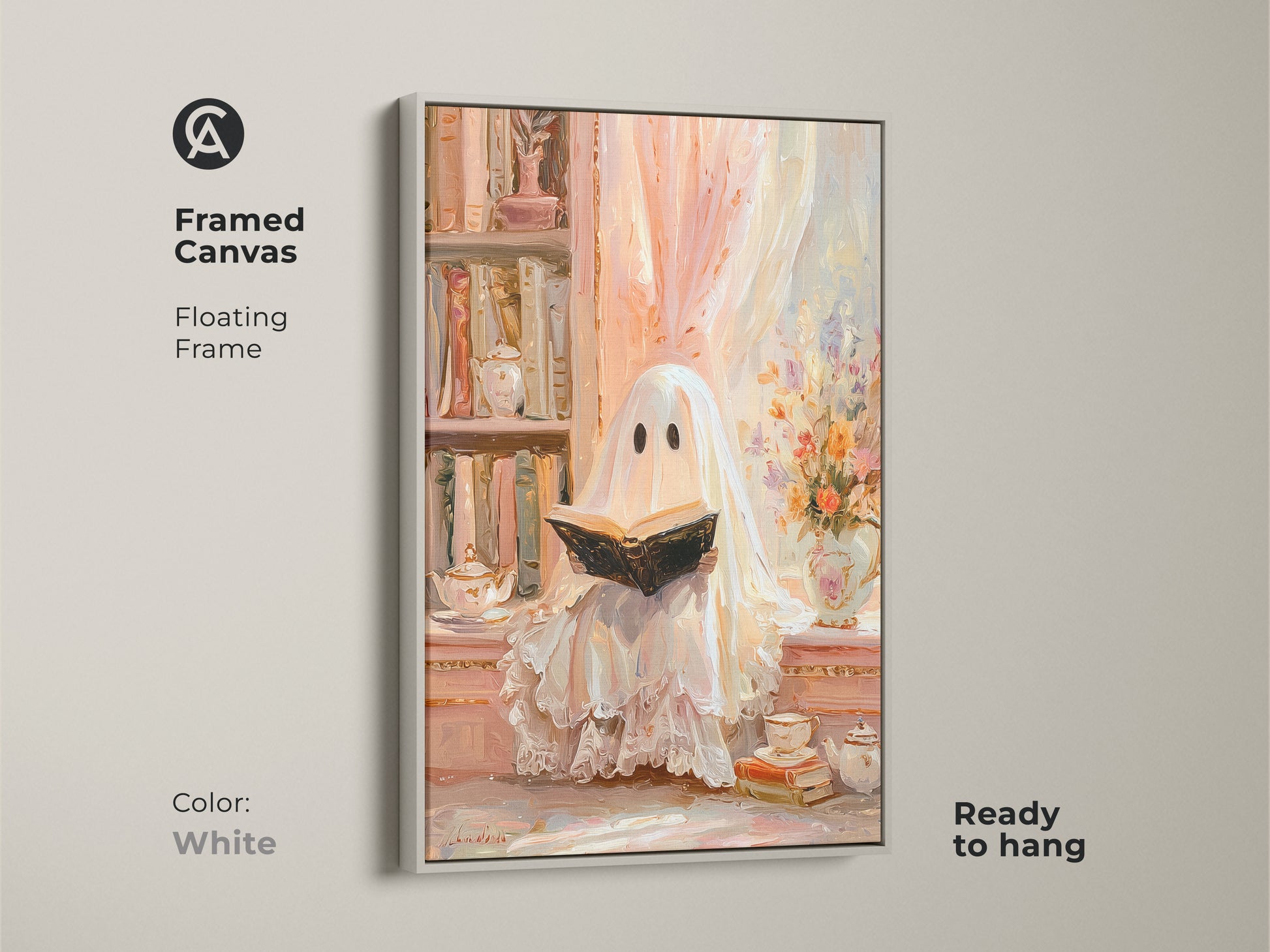 Framed canvas of a ghost reading wall art with a white floating frame. This pastel ghost artwork is ready to hang. It creates a cozy study room decor with an eclectic vibe. A unique Halloween gift for her. The bookshelf art print in cream peach offers a soft vintage touch for book lovers.