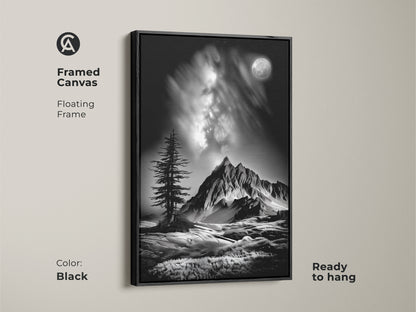 A black framed canvas displays monochrome mountain art. This floating frame highlights a black and white landscape with a moonlit pine tree. Ready to hang contemporary nature artwork.