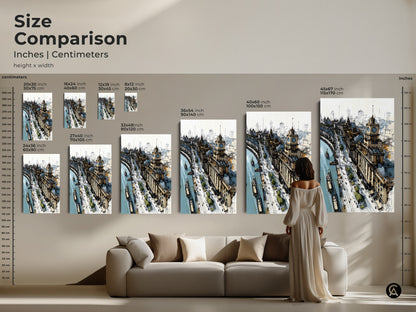 Size comparison of cityscape art prints in inches and centimeters. Visualize how different sizes fit above a sofa. Featuring a detailed sketch with a riverfront and clock tower. Contemporary tan and blue artwork perfect for office decor or as a unique housewarming gift.
