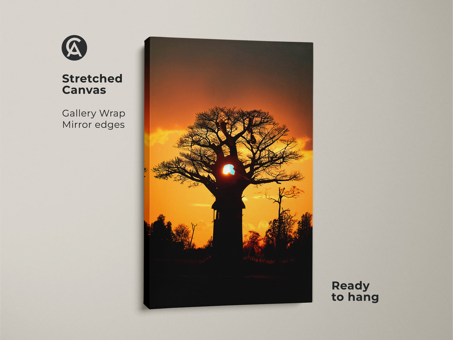 Stretched canvas of an African Baobab tree at sunset. Gallery wrapped with mirrored edges. The orange and yellow hues create a warm nature print. Ready to hang for easy boho home decor.