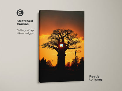 Stretched canvas of an African Baobab tree at sunset. Gallery wrapped with mirrored edges. The orange and yellow hues create a warm nature print. Ready to hang for easy boho home decor.