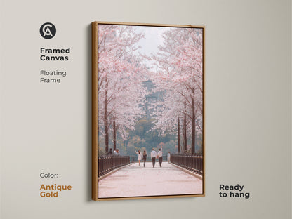 Enhance your space with this framed canvas art. An antique gold floating frame highlights a couple walking under cherry blossoms. This contemporary nature art adds elegance to any room. Ready to hang this romantic spring scene brings seasonal beauty to your home.