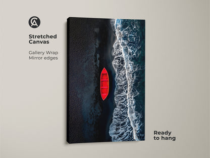 This is a gallery wrapped stretched canvas print of a red boat on a dark beach. The canvas has mirrored edges and comes ready to hang. It is a modern art piece for your home or office space.