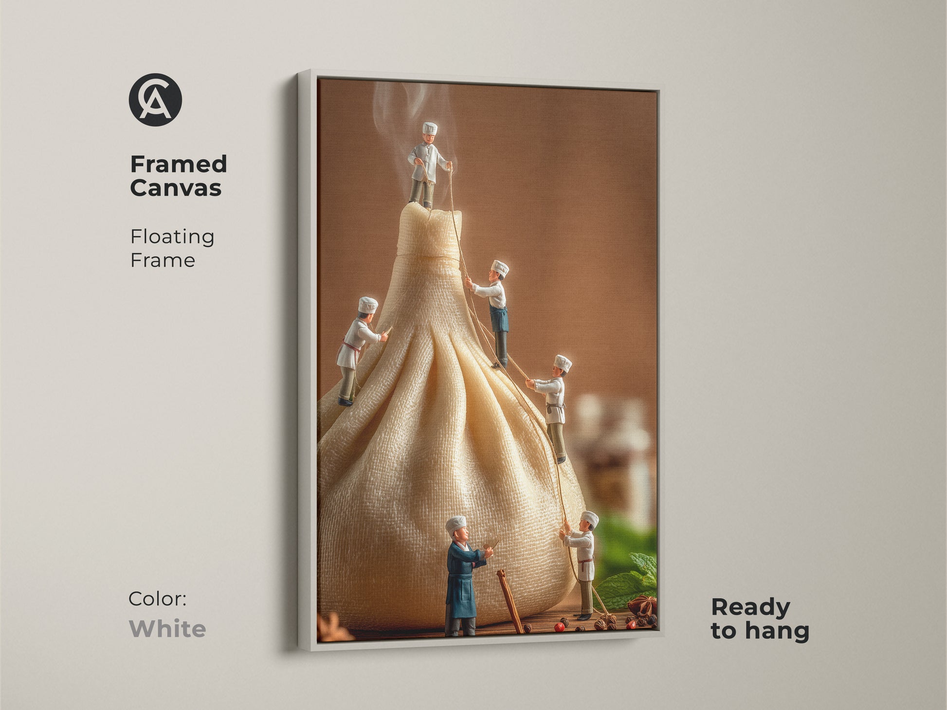 Framed canvas print featuring miniature chefs on a dumpling. The white floating frame provides a clean modern look to this culinary art. Ready to hang this artwork adds a fresh and whimsical touch to any room. A delightful conversation piece.