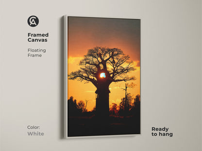 Framed canvas of an African Baobab tree at sunset. The white floating frame creates a clean and modern look. This boho nature print is ready to hang. It is ideal for bedroom wall art or living room decor.