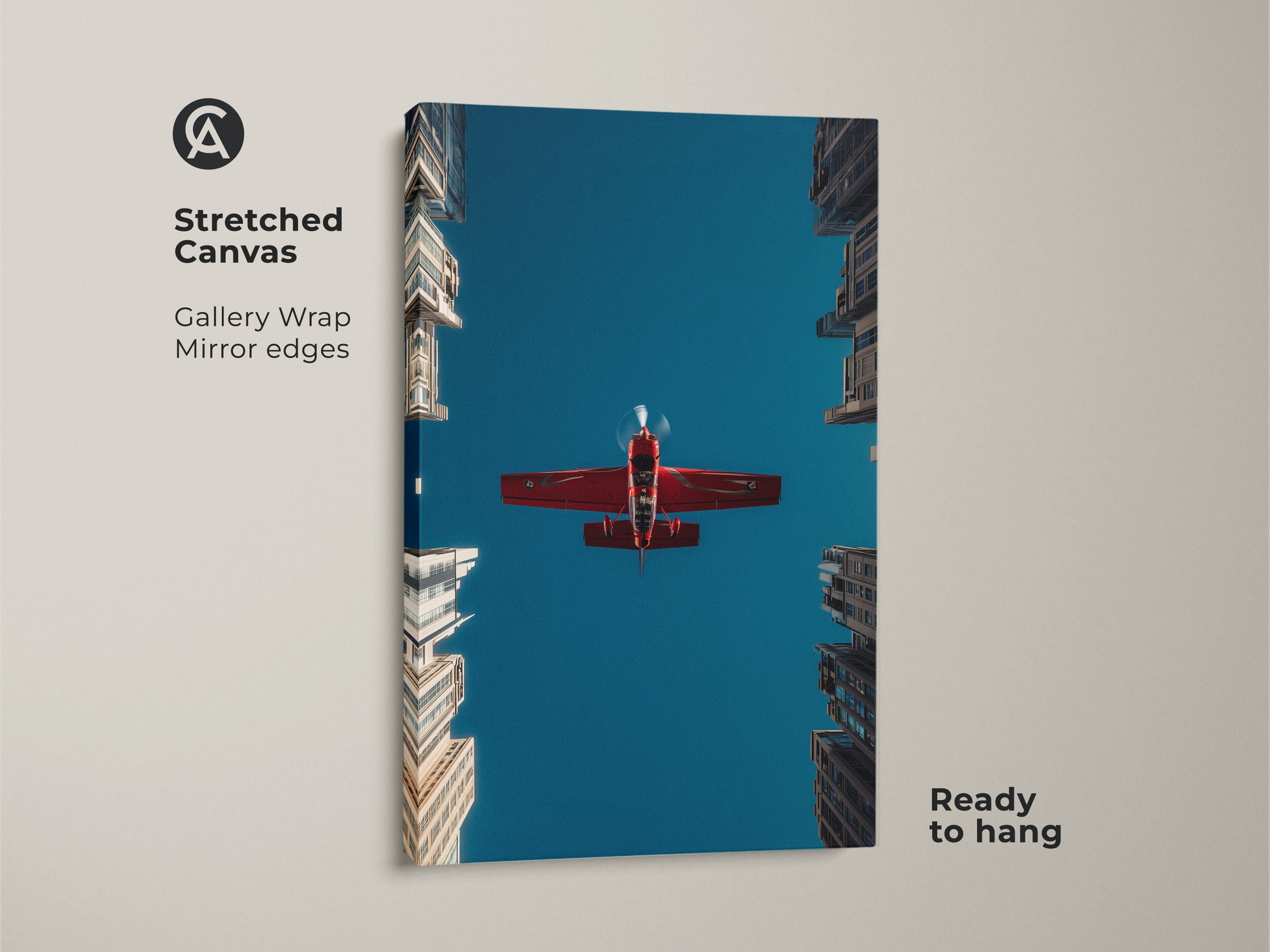 Stretched canvas aviation photography print showing a red airplane against a deep blue sky. The gallery wrap has mirror edges. Modern skyscraper wall art is ready to hang. This aviation enthusiast gift adds a dynamic feel to any space.