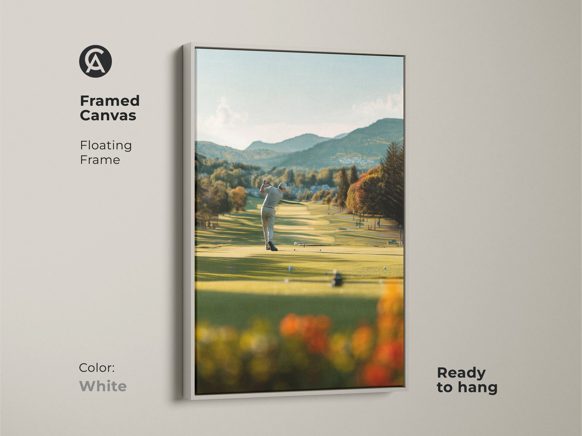 Framed golf artwork on canvas with a floating frame in white color. The golfer is captured at the moment of striking the golf ball. The ready-to-hang art piece adds a touch of sophistication to your decor. The white frame complements the natural scenery.