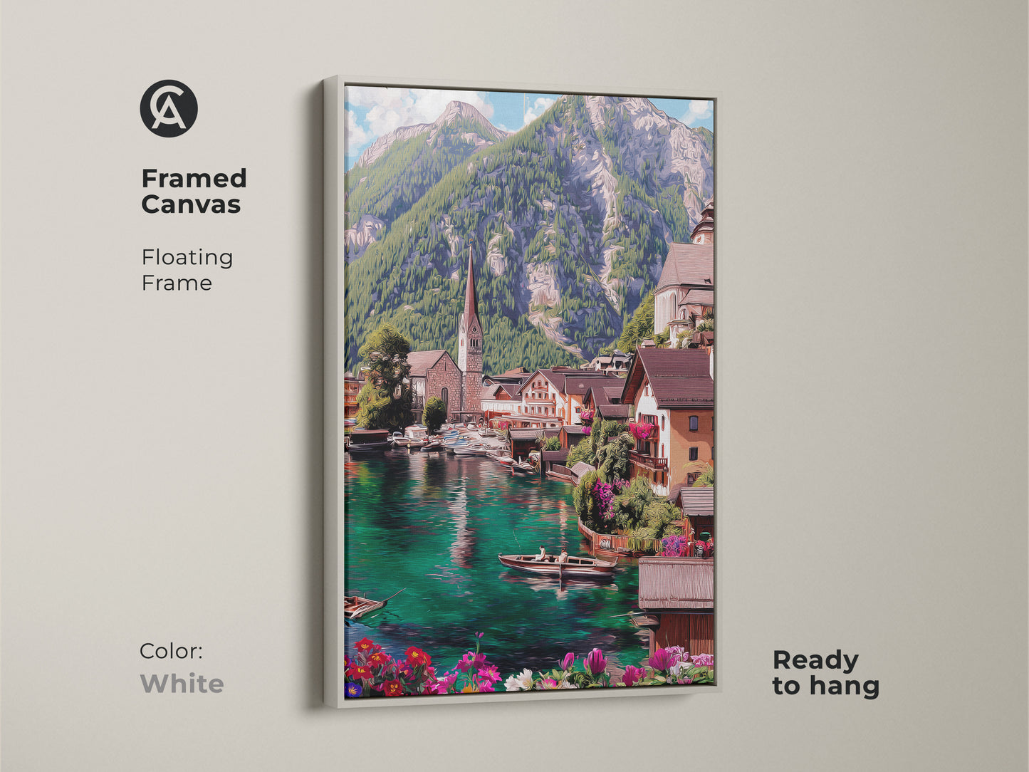 Framed canvas art of a teal lake village with a white floating frame. This ready to hang scenic artwork captures an impressionistic mountain landscape. The European town decor adds a fresh touch to any room. The blue green water complements the charming village view.