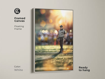 This sports referee artwork is displayed in a white floating frame. The football action photography is a striking piece of sports wall art. The golden hour lighting adds warmth. Ideal for office or home. Ready to hang.