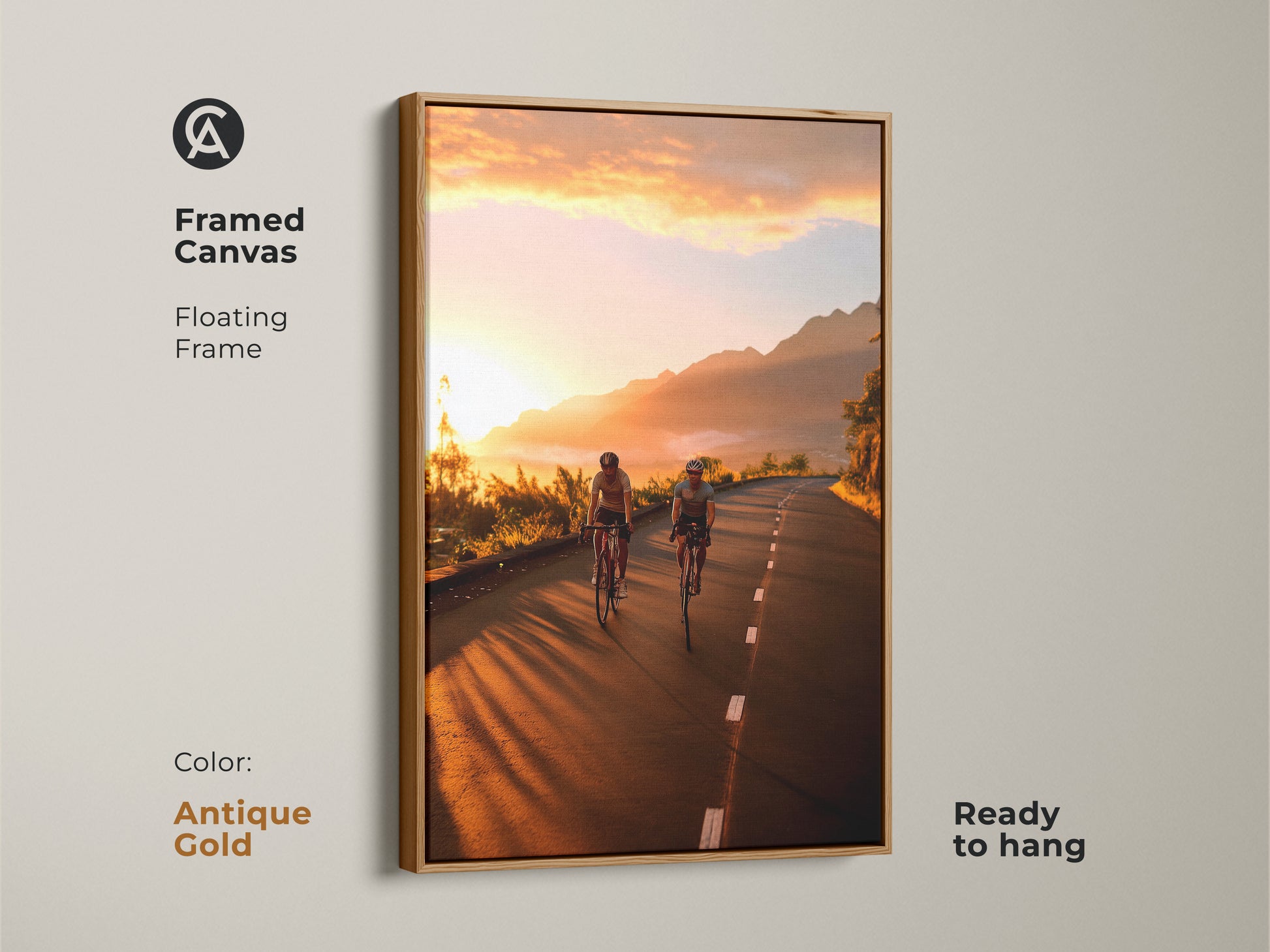 Framed canvas with an antique gold floating frame showcasing cyclists on a mountain road at sunset. Ready to hang and adds elegance to any room. This cycling wall art brings the thrill of adventure to your home. Perfect for contemporary and motivational wall art.