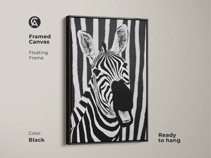 Black framed canvas with zebra art. This floating frame highlights a monochrome zebra portrait against a striped backdrop. Ready to hang it is perfect for contemporary decor. Add minimalist wildlife to your office with this unique piece.