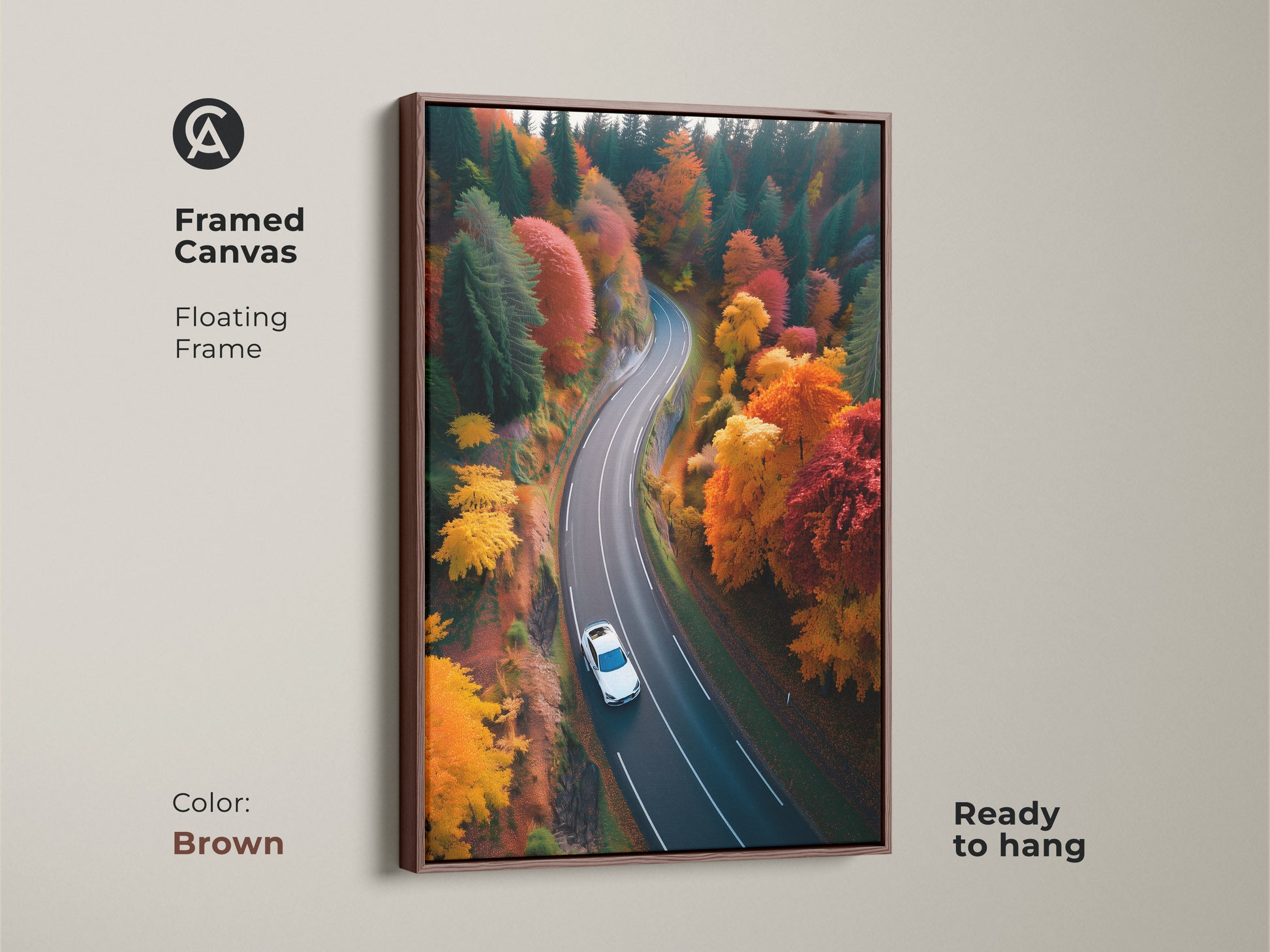 Enhance your living space with framed canvas art of a scenic autumn road. The brown floating frame adds a contemporary touch. A car journeys through a forest of fall colors in this nature photograph. Its ready to hang and enjoy.