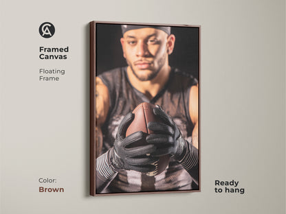 Brown framed canvas featuring an American Football athlete. This sports canvas art is ready to hang. Floating frame showcases the intense athlete portrait. Ideal for home gym artwork or man cave wall decor. A great gift for any football fan.
