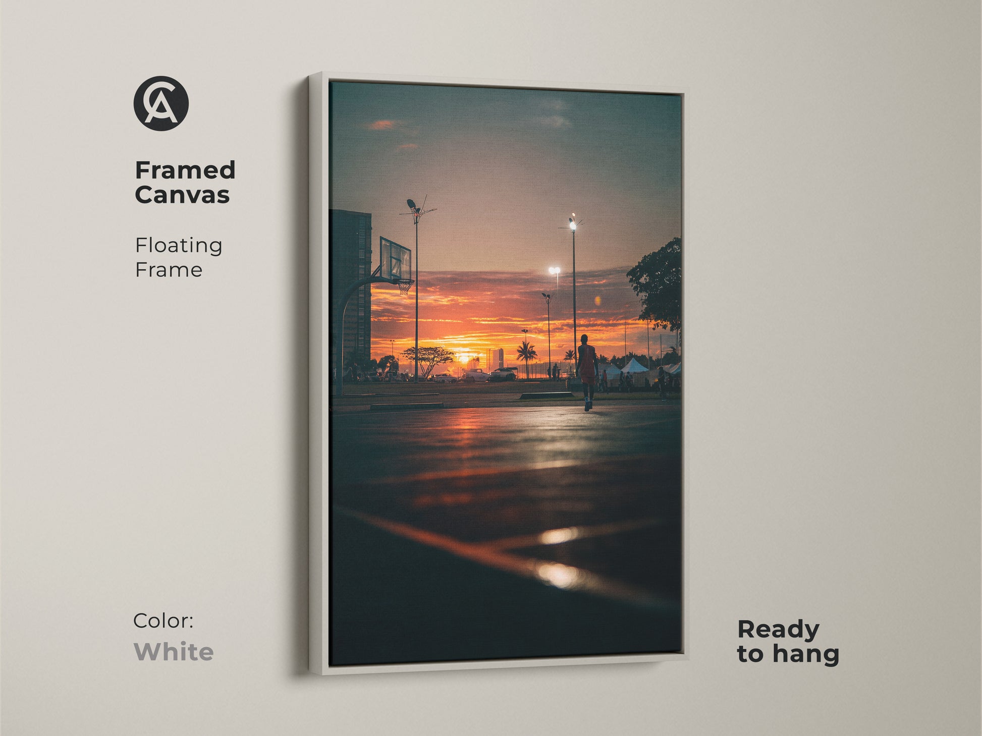 Framed canvas art showcasing a sunset basketball court scene. The white floating frame creates a clean modern look. This ready-to-hang artwork is perfect for minimalist interiors.