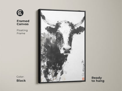 A framed canvas featuring a black and white painting of a bull. The artwork has a floating frame. This is ready to hang. The frame is black. This framed canvas adds a modern touch to any space. Get yours today!