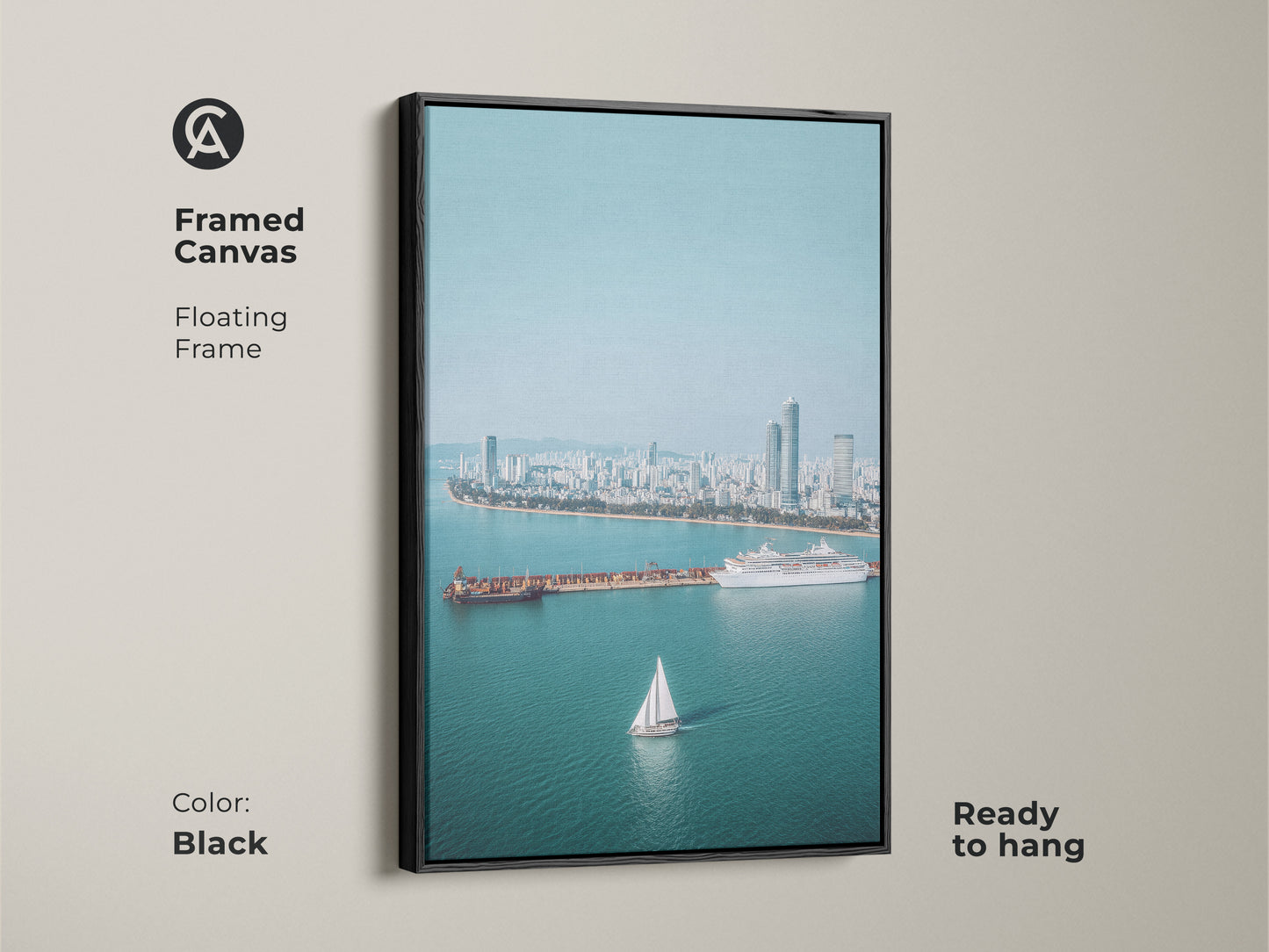 Framed Canvas with a floating black frame showcasing an aerial cityscape. Includes a sailboat cruise ship. Ready to hang. Blue teal artwork adds a contemporary touch.