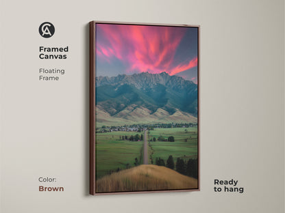 Brown framed canvas shows a pink sunset mountain landscape. The ready-to-hang floating frame art fits any room. Complements modern farmhouse decor. A housewarming gift for outdoor lovers. Scenic bedroom wall art adds charm to residential decor.
