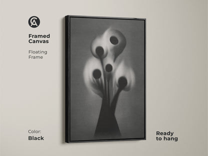 High quality abstract botanical art print featuring a gothic flower. This surreal black white grey canvas is ideal for study room or office decor. Framed in a brown floating frame it adds a sophisticated artistic touch. Perfect for eclectic home styles.