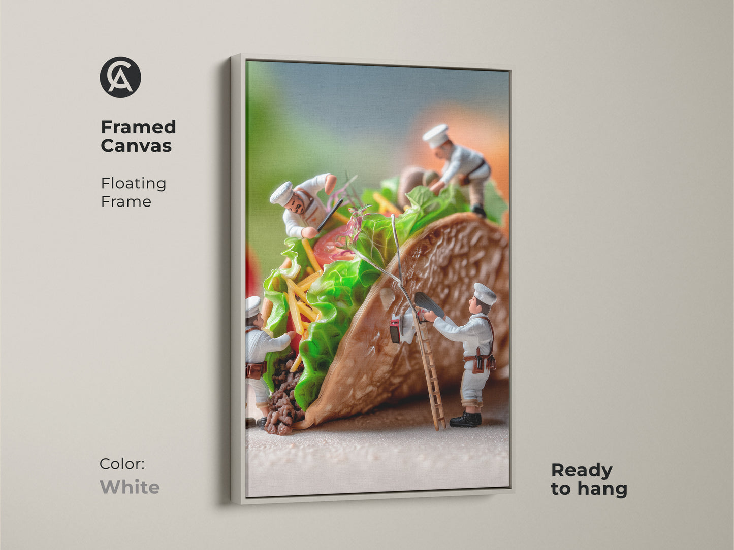 Framed canvas artwork of miniature chefs constructing a taco. The floating frame is white. This food art offers a clean modern look. The chefs are adding fresh ingredients. Ready to hang this piece is perfect for a minimalist kitchen or dining area.