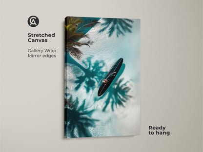 Transform your walls with this gallery-wrapped canvas art. It shows a surfer floating on the water. The overhead shot captures turquoise water and palm shadows. The mirror edges enhance the depth of this coastal artwork. It's ready to hang offering an instant upgrade to your home decor.