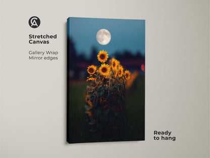 Stretched canvas gallery wrap of a sunflower moon art print. The mirror edges enhance the dreamy celestial artwork. Yellow orange floral art meets deep blue boho decor. Ready to hang this nature landscape art in your living room or bedroom.