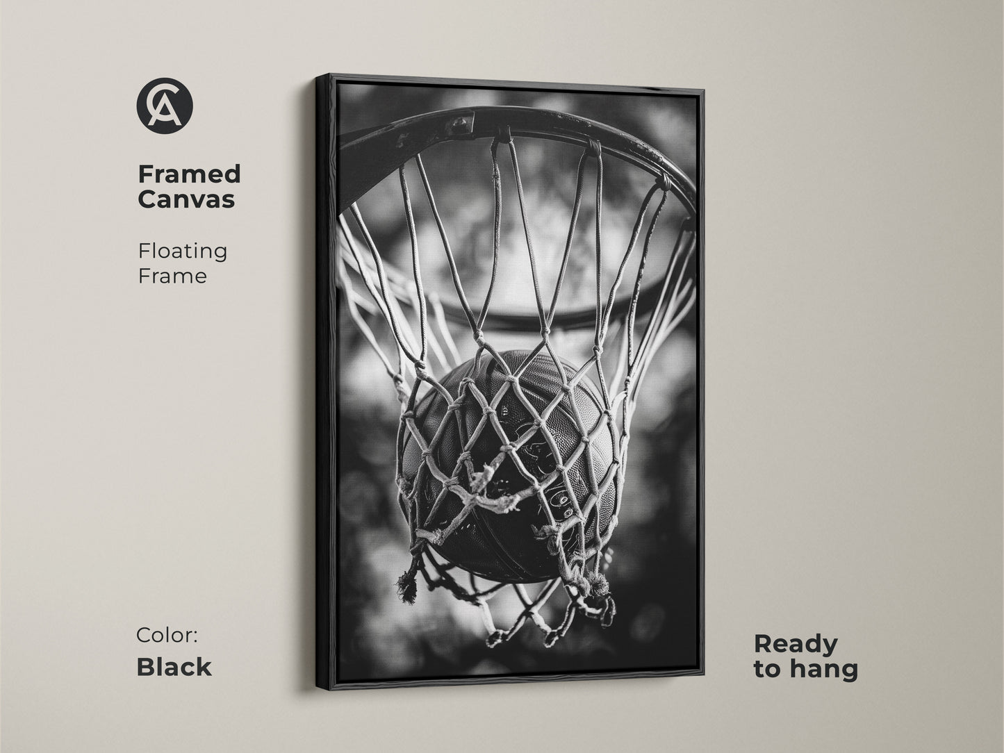 Black framed basketball canvas art. This floating frame canvas is ready to hang. The black and white artwork features a basketball in a net. Enhance your decor with sports-themed art.