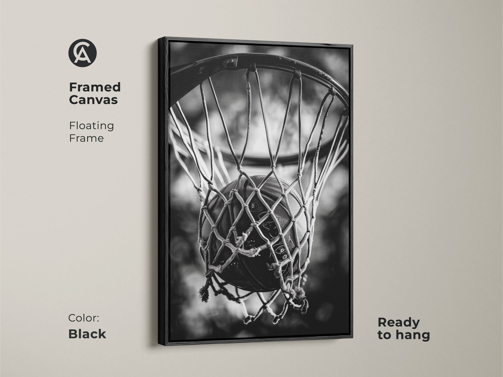 Black framed basketball canvas art. This floating frame canvas is ready to hang. The black and white artwork features a basketball in a net. Enhance your decor with sports-themed art.