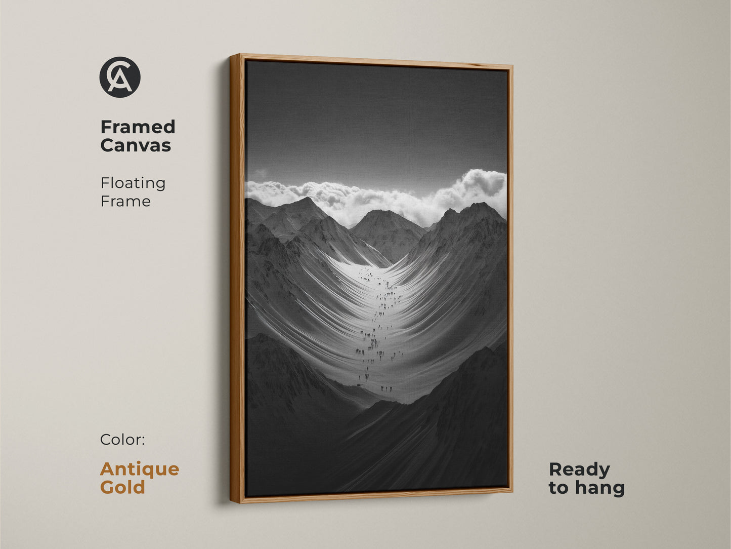 Framed black and white mountain art print with a antique gold floating frame. This monochrome canvas art is ready to hang. The hikers are ascending a vast snowy mountain range. This nature scenery wall art adds adventure to any space.