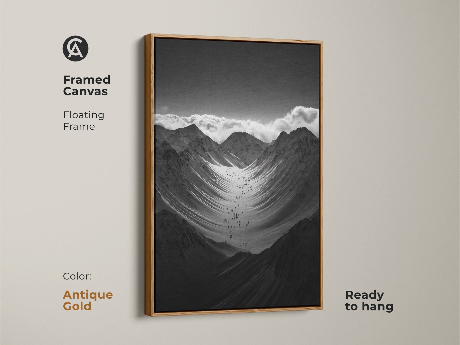 Framed black and white mountain art print with a antique gold floating frame. This monochrome canvas art is ready to hang. The hikers are ascending a vast snowy mountain range. This nature scenery wall art adds adventure to any space.