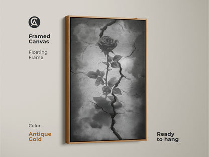 Antique gold framed canvas featuring gothic rose artwork. The floating frame accentuates dark floral artwork with a rose from cracked earth. This surreal botanical art uses black white and gray tones. Ready to hang this piece enhances gothic decor. It's symbolic rose art for eclectic home decor.