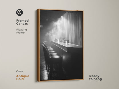 Framed canvas print of a monochrome bar. This floating frame is antique gold and ready to hang. The cinematic scene offers industrial decor. It's a black and white artwork for a lounge. This is perfect for home bar art.