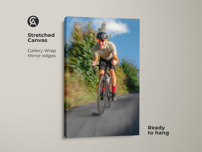 Stretched canvas featuring motion blur cycling art. Gallery wrapped with mirrored edges this blue grey artwork is ready to hang. It captures the speed and intensity of road cycling. Ideal sports art for a man cave or home gym.