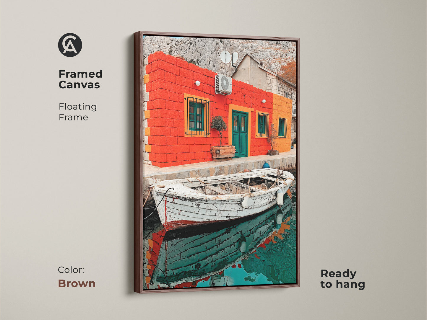 The framed canvas in a brown frame displays a Mediterranean house print. The coastal boat artwork and realism landscape make it a thoughtful travel lover gift. This is vibrant Mediterranean decor.