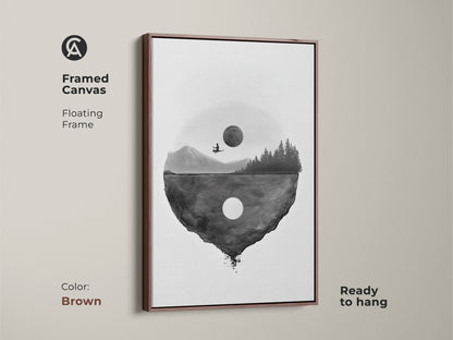 Framed canvas showcasing minimalist floating island art with a brown floating frame. This surreal moon landscape print is ready to hang. The black and white abstract artwork adds a touch of modern style to any home interior it's a great housewarming gift.