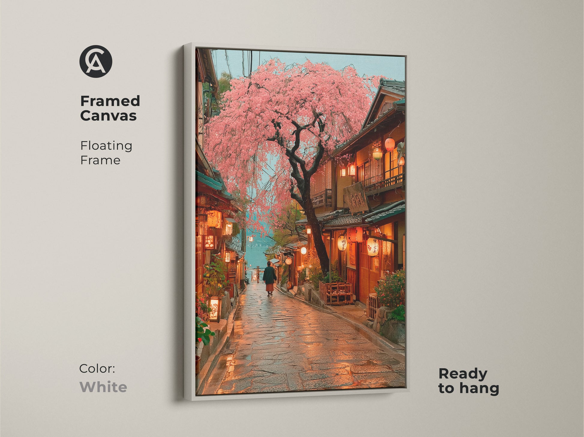 White framed canvas art print of a Japanese street with pink cherry blossoms. This travel wall art adds a fresh eclectic touch to any room. Ready to hang this artwork blends nature with traditional architecture. This piece is a perfect housewarming gift that brings a romantic street scene indoors.